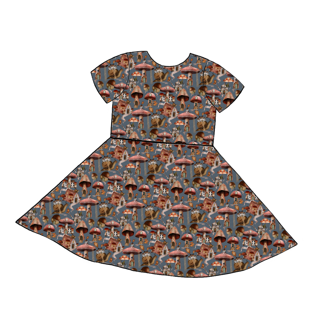 Short sleeve handmade twirly dress in Mushroom Town – whimsical jersey with toadstools, mushroom homes and snails on a soft blue base.