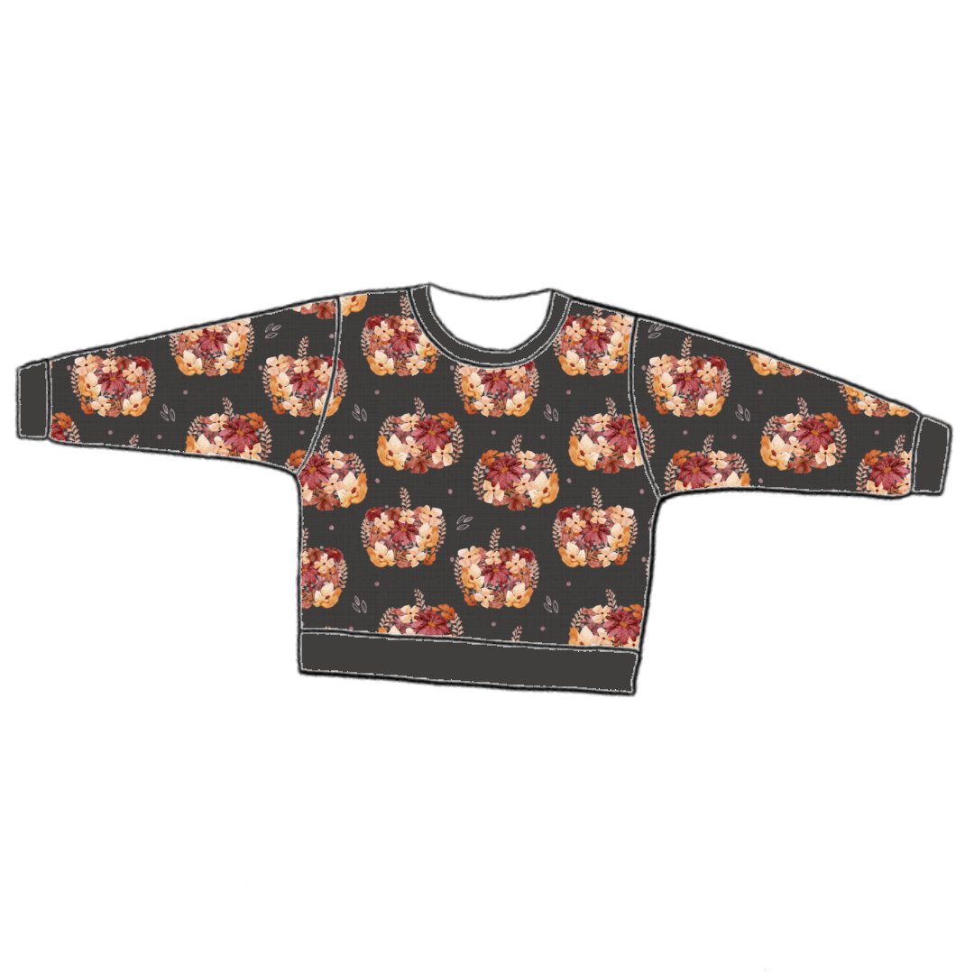Handmade lounge sweater in Baize – charcoal jersey with peach and burgundy floral pumpkins, finished with soft ribbed trim.