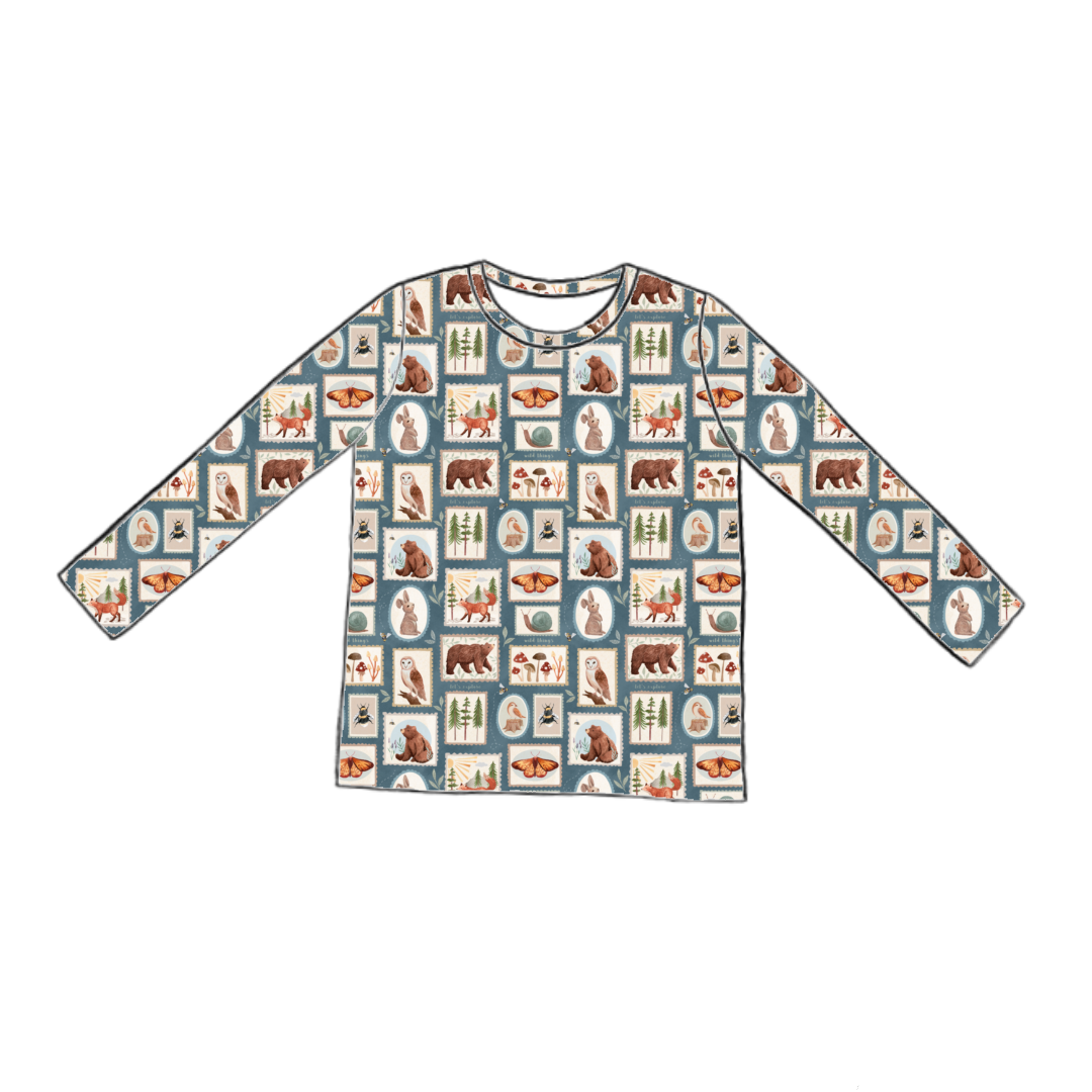 Long sleeve handmade T-shirt in Wild Stamps – jersey with woodland tile print in dusky blue, rust and cream.