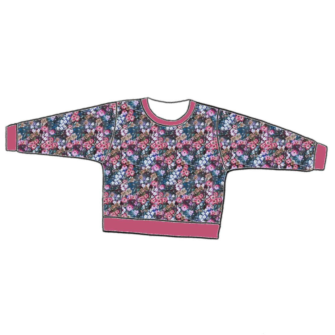 Handmade lounge sweater in Matilda Floral – bold blue jersey with painterly florals in fuchsia, violet and green, finished with ribbed cuffs and hem.