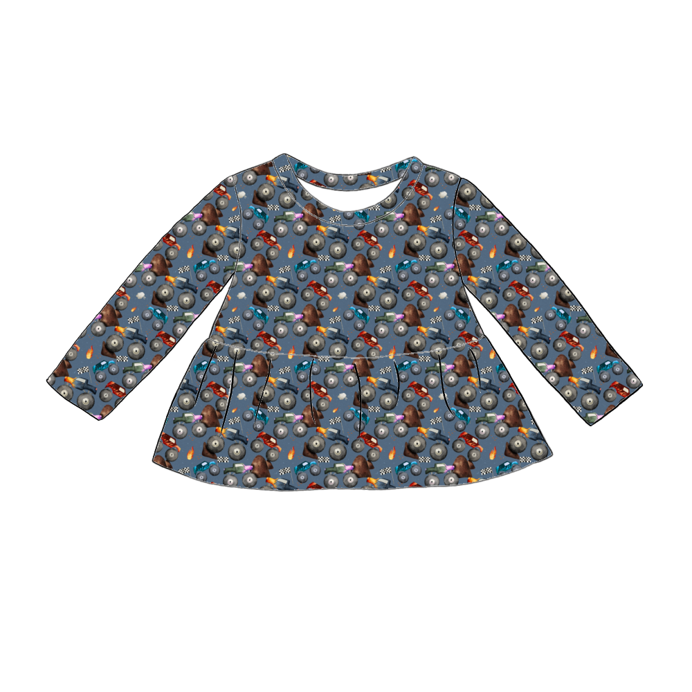Handmade long sleeved peplum top in Monster Trucks – blue jersey with colourful trucks, flames and racing flags. 