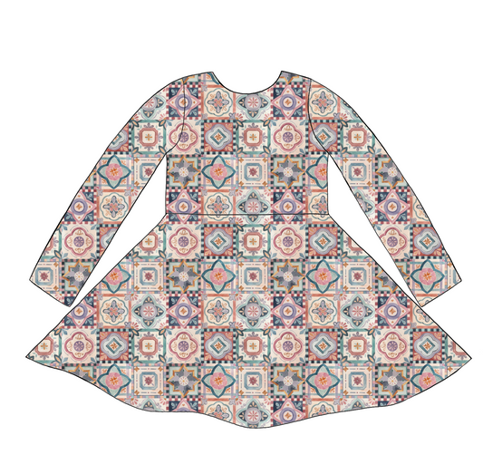 Long sleeve handmade twirly dress in Faro – tile-style jersey print in terracotta, blush, navy and soft green.