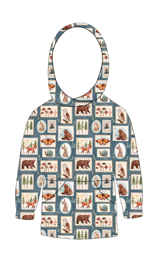 Handmade hoody in Wild Stamps – dusky jersey with woodland animals and folk-style tile motifs, lined hood and front pocket.