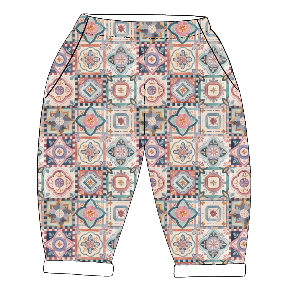 Handmade children’s vintage pocket trousers in Faro – patterned tile print in warm autumnal tones with rolled hems and roomy side pockets.
