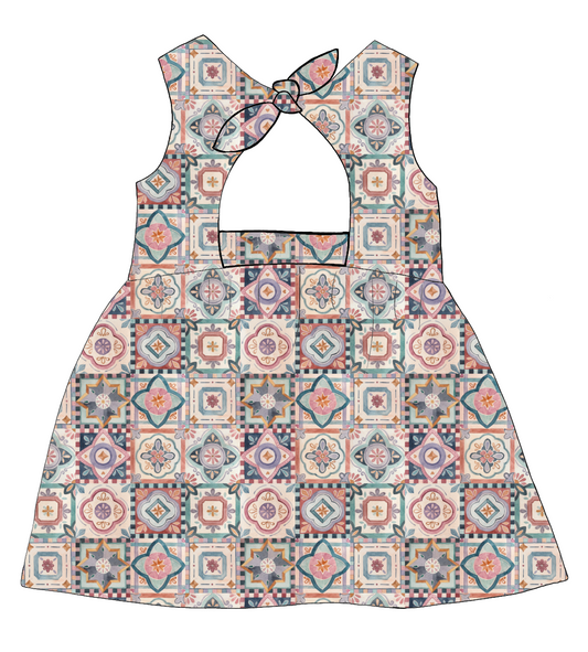 Bow Back Dress in Faro – vintage-style tile print jersey in terracotta, blush, navy and soft green with lined bodice and bow back detail.