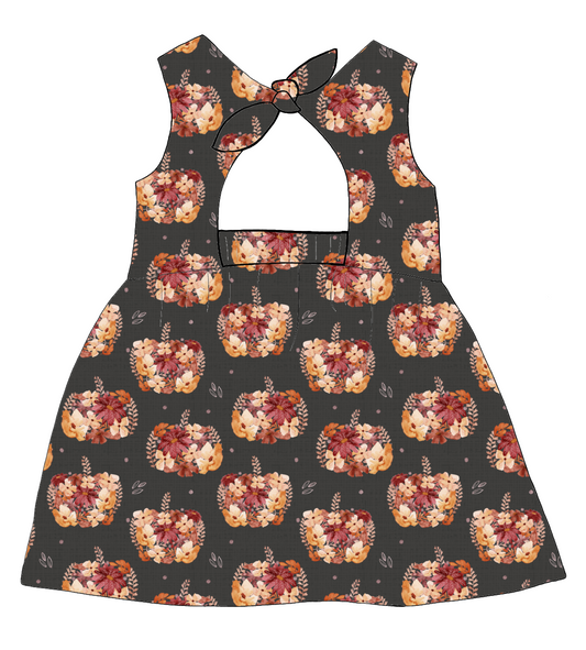 Bow Back Dress in Baize – charcoal jersey with peach and burgundy floral pumpkins, featuring a lined bodice and bold bow back.