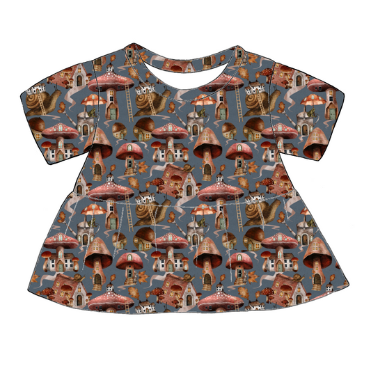 Handmade short sleeved peplum top in Mushroom Town – whimsical jersey with mushroom houses, snails and leafy toadstools on a blue-grey base.