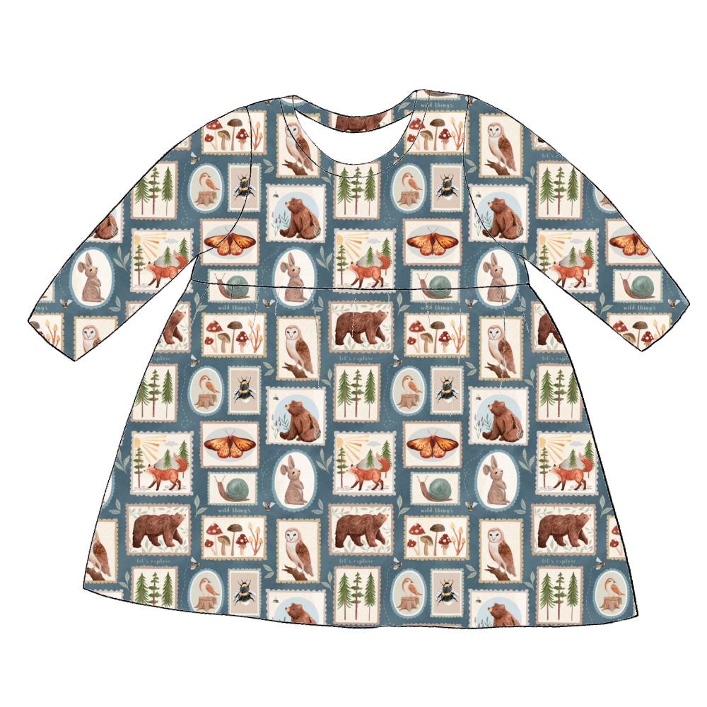 Long sleeve handmade gathered dress in Wild Stamps – jersey with woodland tile print in dusky blue and rust tones.