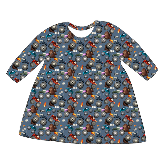 Long sleeve handmade gathered dress in Monster Trucks – soft blue jersey with monster trucks, flames and racing flags.