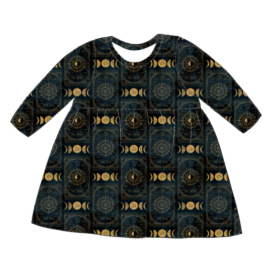 Long sleeve handmade gathered dress in Tarot – black and gold jersey with stars, moons and celestial symbols.