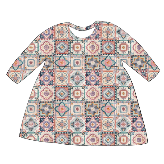 Long sleeve handmade gathered dress in Faro – tile-style jersey print in terracotta, blush, navy and soft green.
