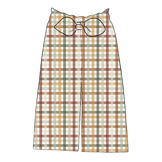 Wide leg paperbag trousers in Harvest Gingham – rust, mustard and sage check with elastic waist and large bow at front.