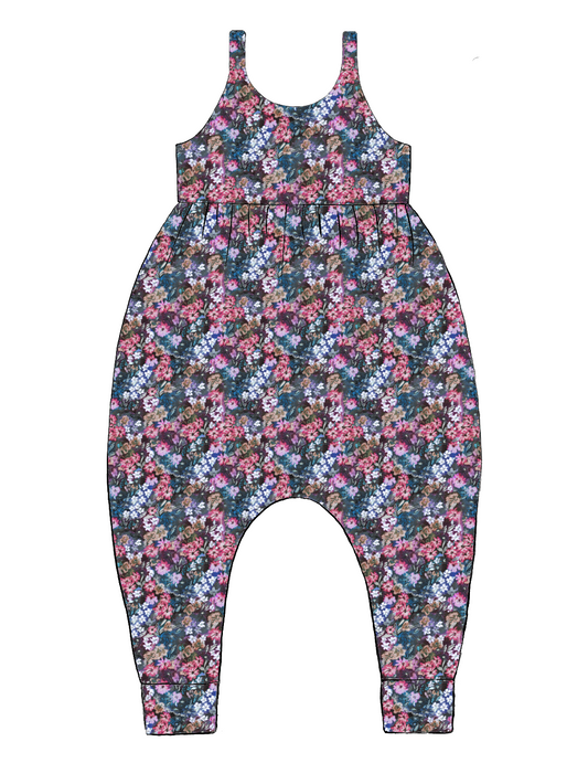Handmade Napa Romper in Matilda Floral – deep blue jersey with layered florals in pink, purple and green. Harem-style fit with soft cuffs.
