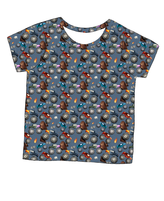 Short sleeve handmade T-shirt in Monster Trucks – bold blue jersey with colourful trucks and racing-themed print.