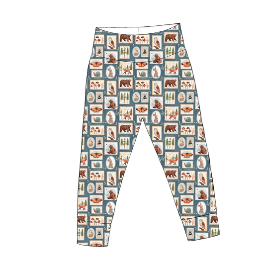 Handmade leggings in Wild Stamps – dusky blue patchwork with foxes, bears, bees and florals, cuffed ankles and yoga waist.