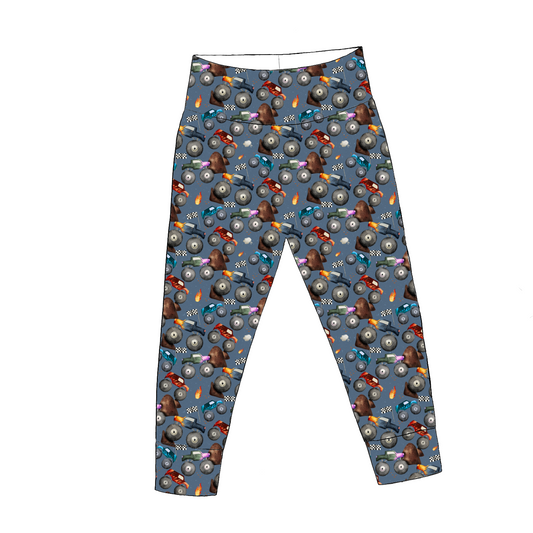 Monster Trucks leggings – bold blue print with watercolour trucks, flames and racing flags, yoga waistband and ankle cuffs.
