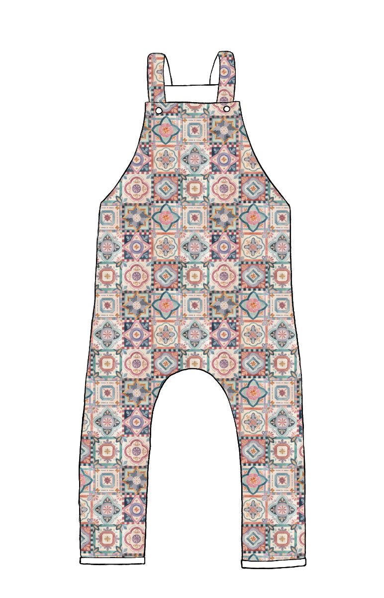 Full-length handmade dungarees in Faro – ornate tile-style pattern in warm muted colours of terracotta, navy and blush.