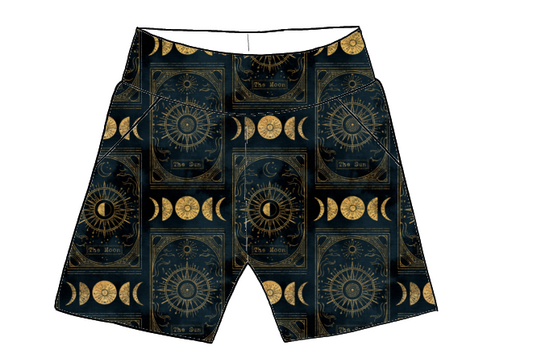 Children’s handmade pocket shorts in Tarot fabric – deep navy base with golden suns, moons and tarot card-inspired motifs.