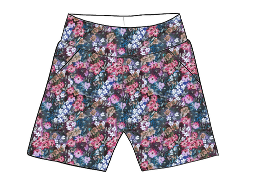 Children’s pocket shorts in Matilda fabric – navy background with colourful brushstroke florals in fuchsia, lilac and blue.