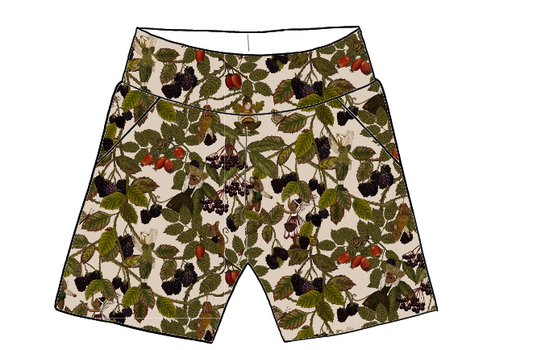 Children’s pocket shorts in Hedgerow fabric – warm-toned woodland print featuring blackberries, fairies, birds, and brambles on a light base.