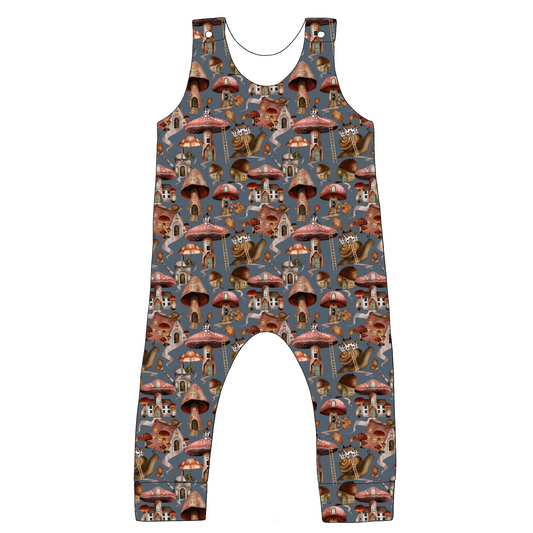 Flat lay of the Standard Romper in Mushroom Town fabric – a whimsical print featuring mushrooms, snails, and leaves on a neutral background.
